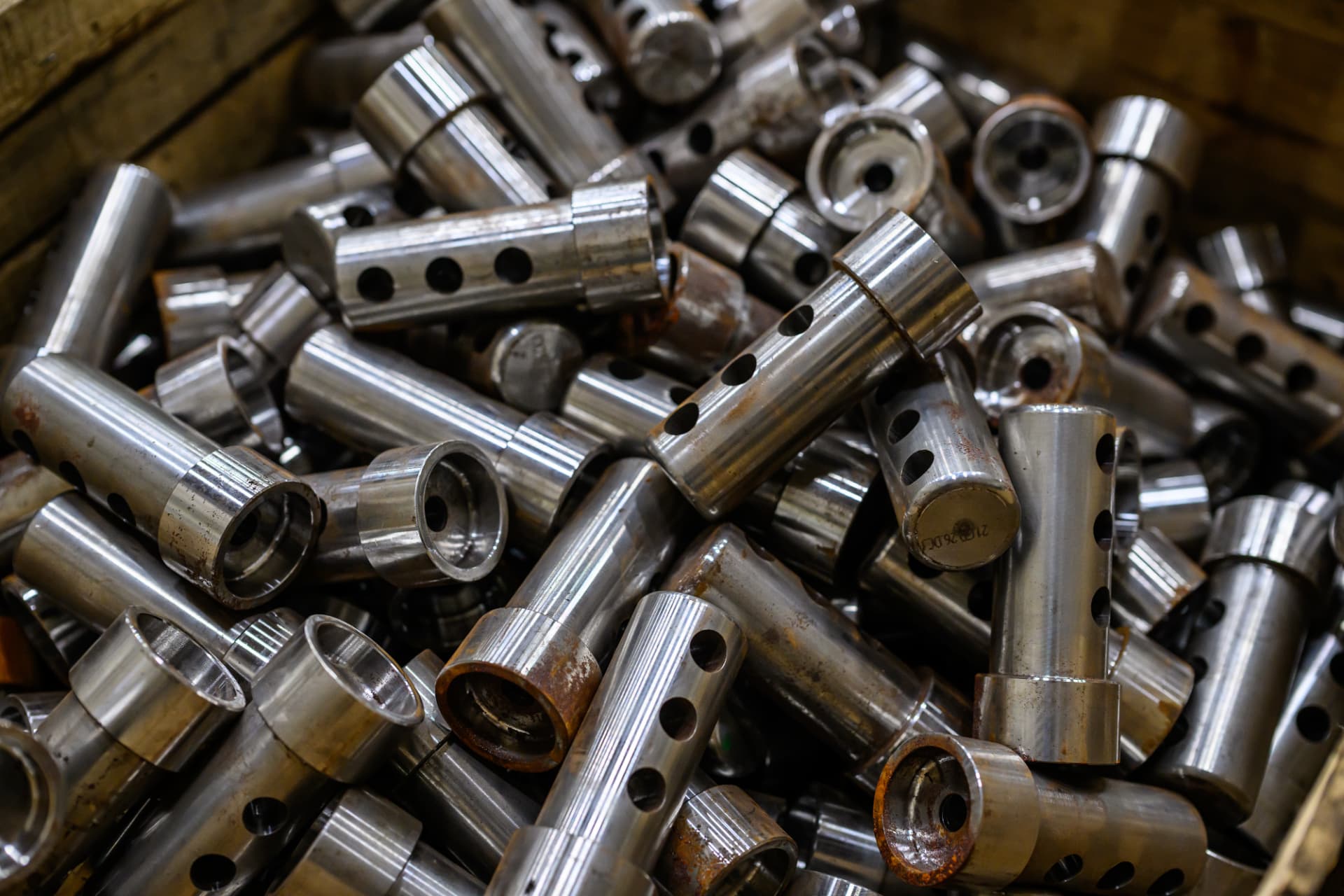 Finished steel couplers with drilled connection holes